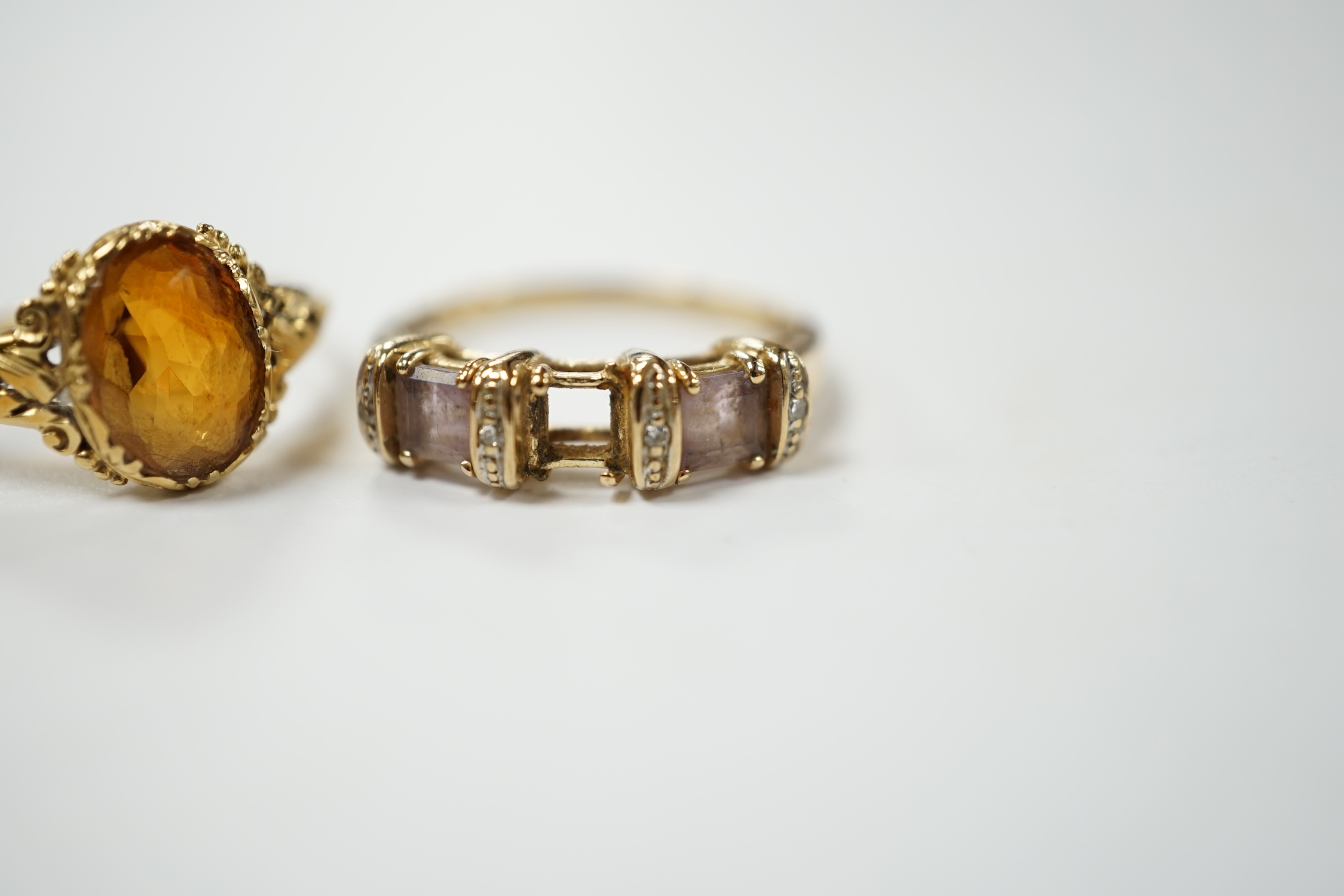 A 14k and single stone oval cut citrine set ring, size O, gross weight 2.8 grams and a modern 9ct gold and gem set ring (lacking stone), gross weight 2.3 grams. Condition - poor